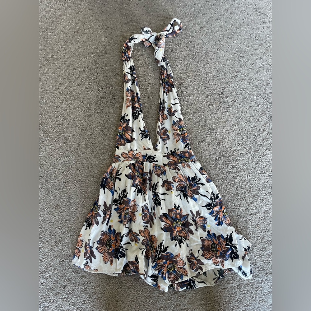 White patterned deep v open back romper